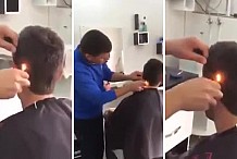 (Vidéo) Il utilise un briquet pour couper les cheveux