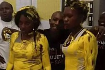 Zambie : Les responsables d'un magasin de vêtement peignent deux voleuses en jaune.